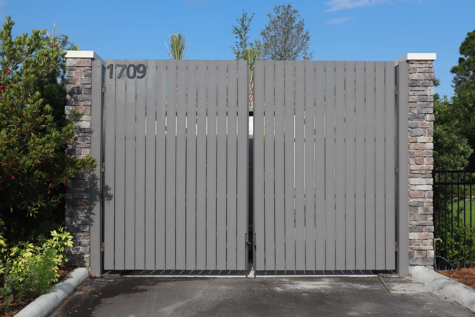 Commercial compactor enclosure gate by Becotte Construction